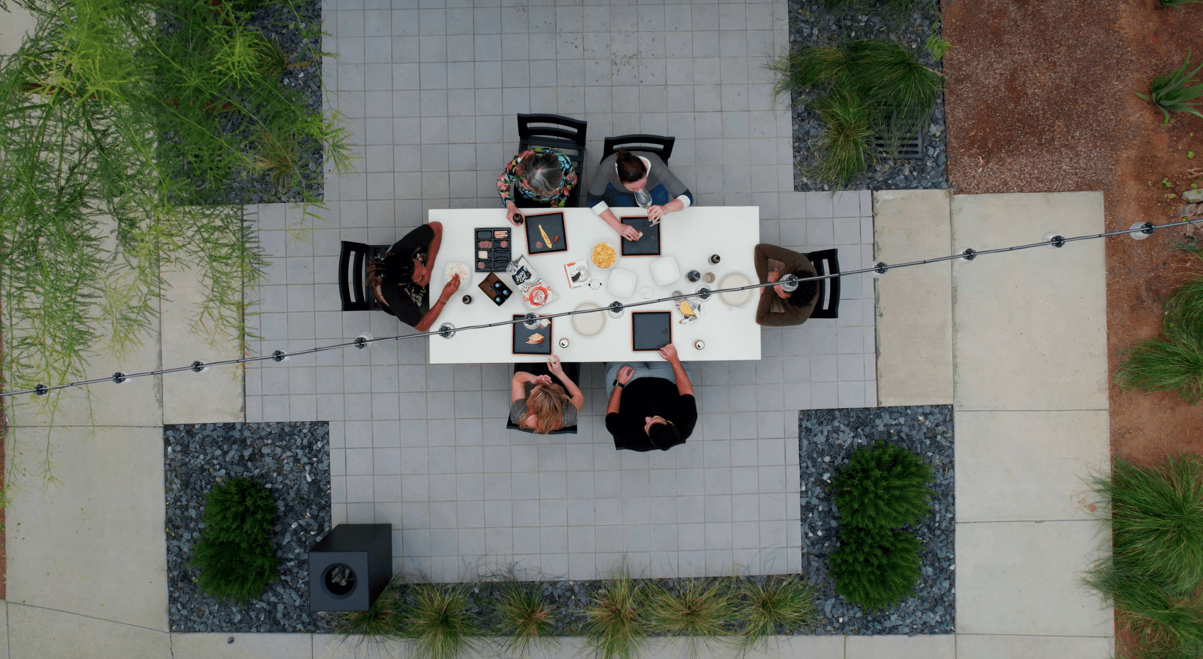 Overhead shot of people enjoying a meal in one of Culdesac's many courtyards.